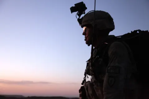 Staff Sgt. Roger Schilling scans the terrain during a night patrol.